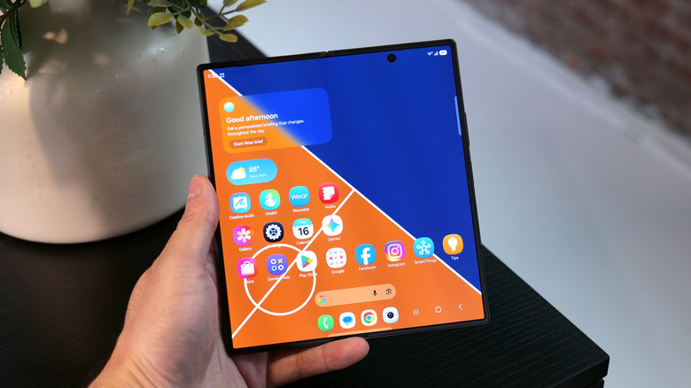 Samsung Galaxy Z Fold 8 Ultra opened up in someone's hand.