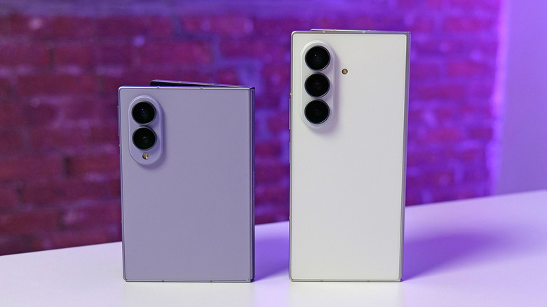 The Samsung Galaxy Z Fold 8 and Z Fold 8 Ultra standing upright on a table, showing their back cameras.