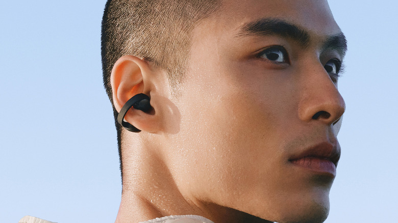 A man wearing Samsung's Galaxy Buds On wireless ear buds.