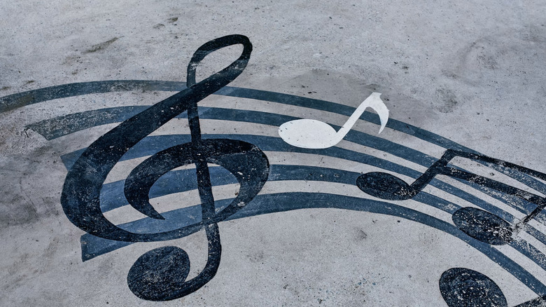 Music notes on concrete.