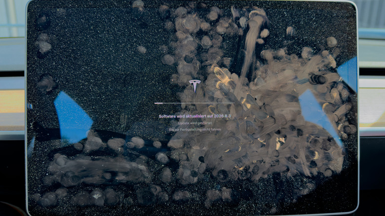 A Tesla touchscreen, heavily covered in fingerprints.