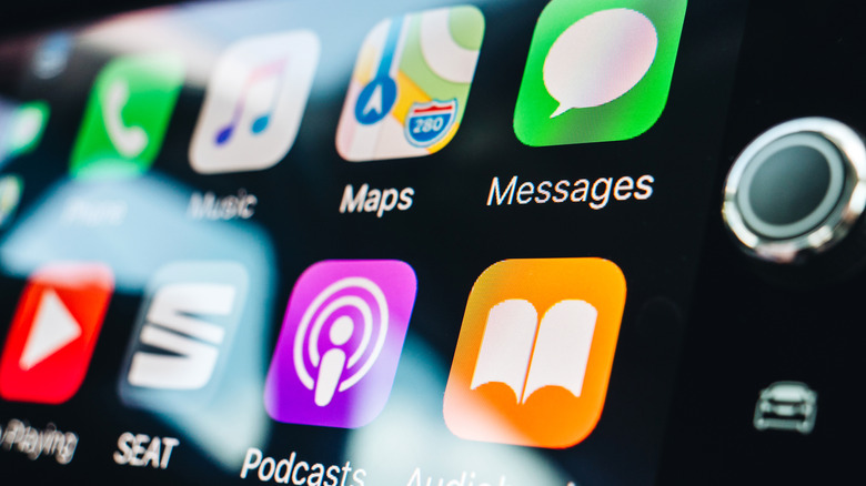 A zoomed-in view of an Apple CarPlay display, showing app icons.