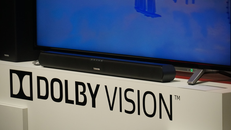 A TV sits on a display shelf, advertising Dolby Vision.