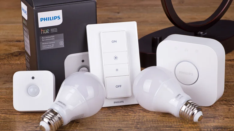 Collection of Philips Hue smart home tech, including sensor, light bulbs and switch.