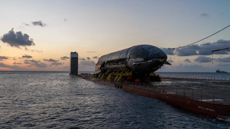 The upper stage of SpaceX Starship 40, cradled onto a transport ship's cargo deck