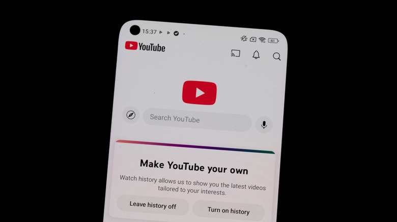 A phone screen showing the YouTube app, with options to leave history off or turn on history.