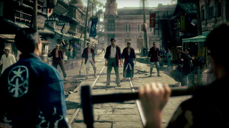 In a screenshot from the video game Stranger than Heaven, two rival groups face off in an early-20th-Century Japanese street scene.