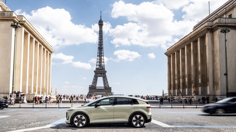 Audi's A2 e-tron in front of the Eiffel Tower.