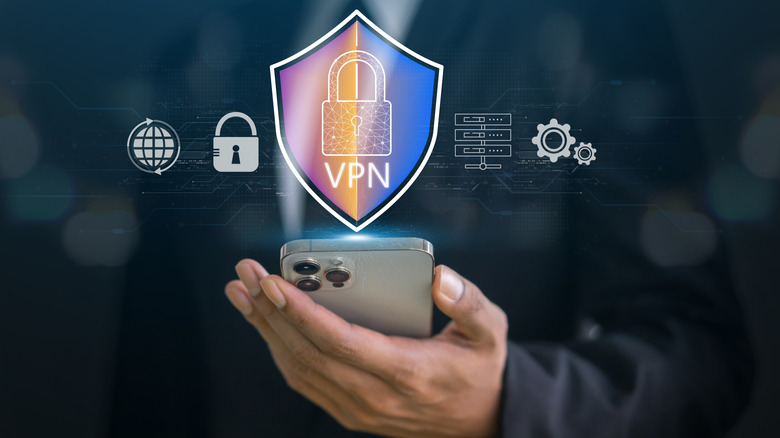 A hand holding a phone displays a blue and pink VPN sign flanked by symbols displaying the technology's various features.