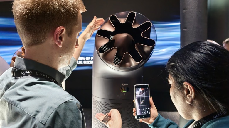 Dyson's new air purifier being demonstrated at a launch event.