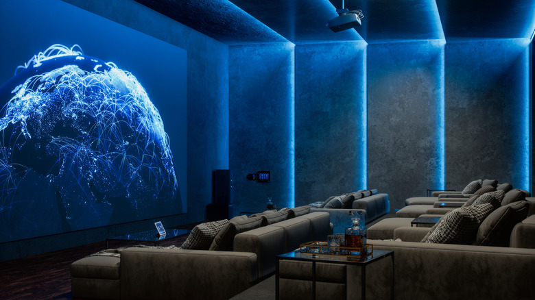 The interior of a private movie theatre with playback on the screen.