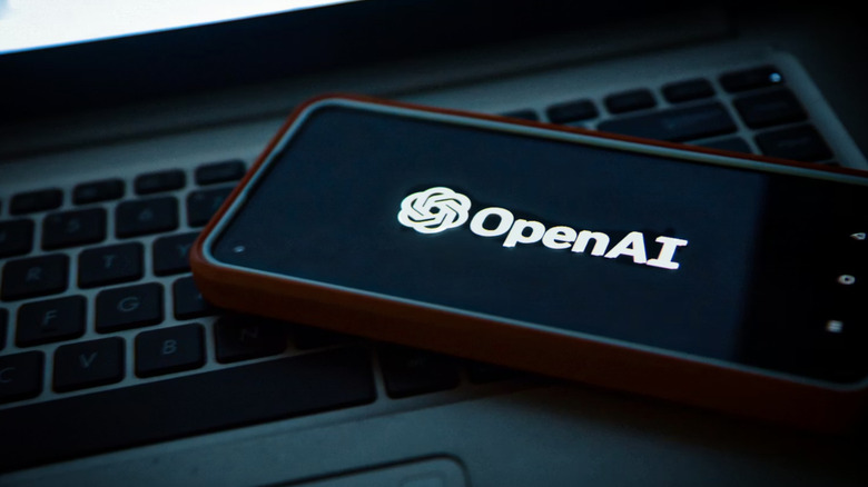 A phone with the company's logo on a laptop.