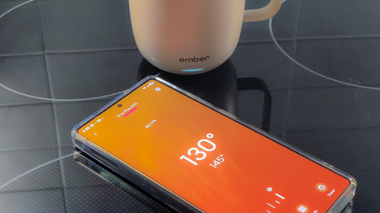 Ember app open on Samsung Galaxy S25 Ultra smartphone with Ember Mug 3 next to it.