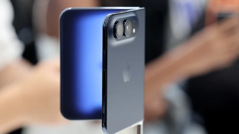 A hazy screen transition on the Night Sky version of the iPhone Duo, shown in a store.
