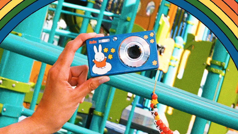 A camera in front of a rainbow.