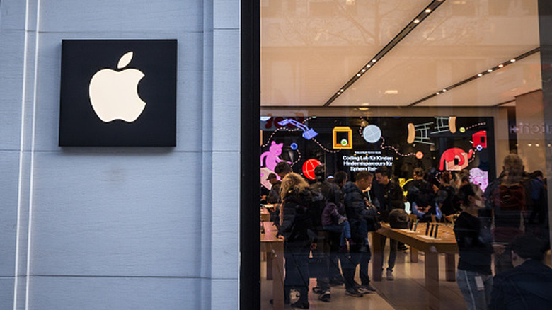 People shopping inside an Apple Store