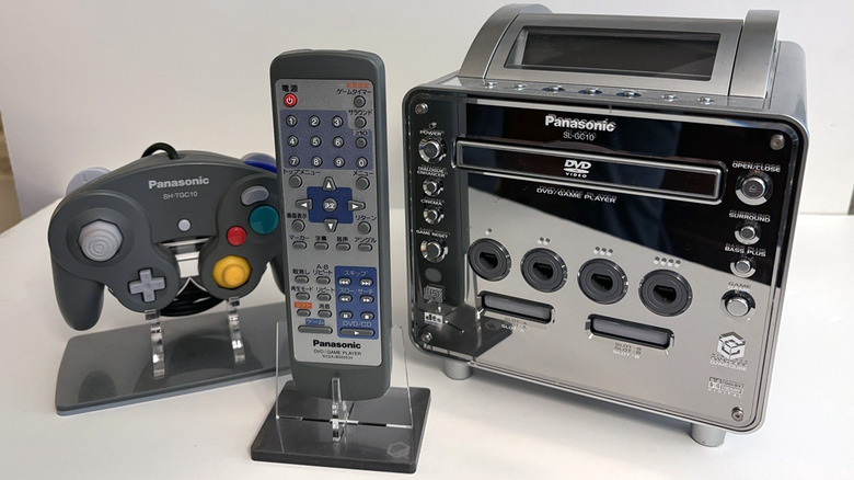 A Panasonic Q game console with remote and controller.