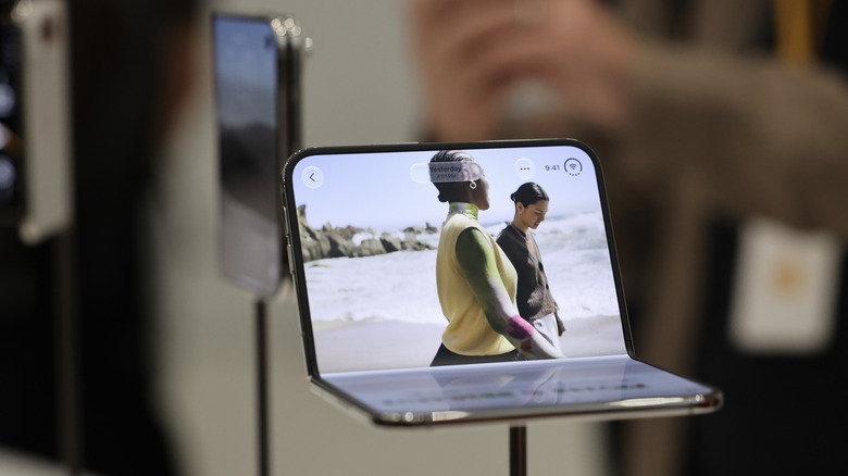 An Apple iPhone Duo displayed on a stand.