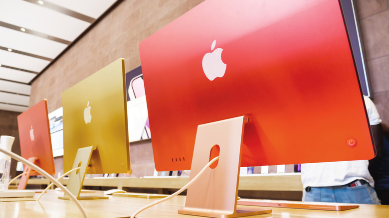 A row of iMac all-in-one computers.