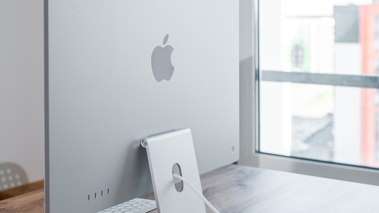 iMac monitor sitting on a desk.
