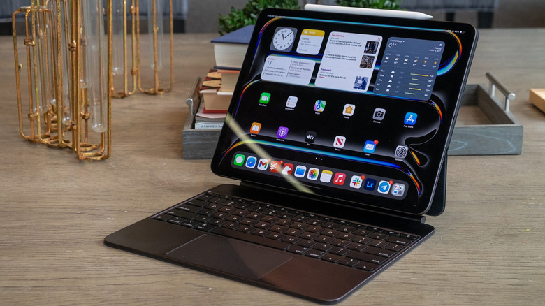 An iPad Pro (2024), with Magic Keyboard and Apple Pencil, on a desk.