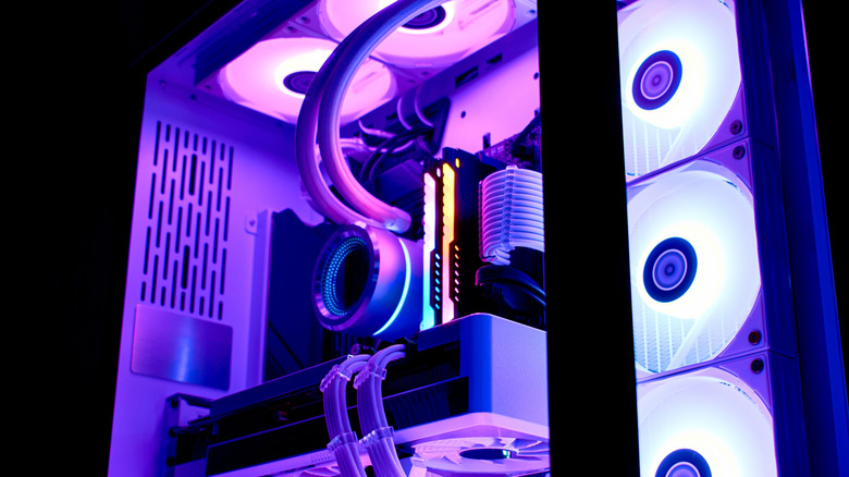 A close-up of a gaming PC with liquid cooling and RGB lighting.