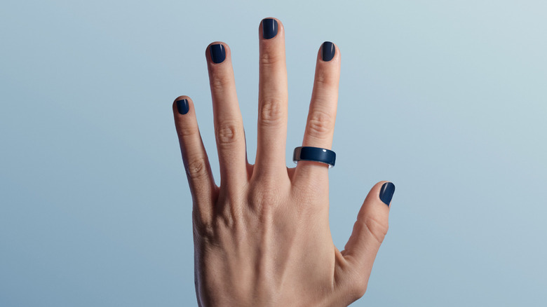 A hand with a ring on it.