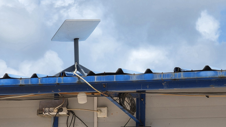 A Starlink Mini dish placed on top of a roof.