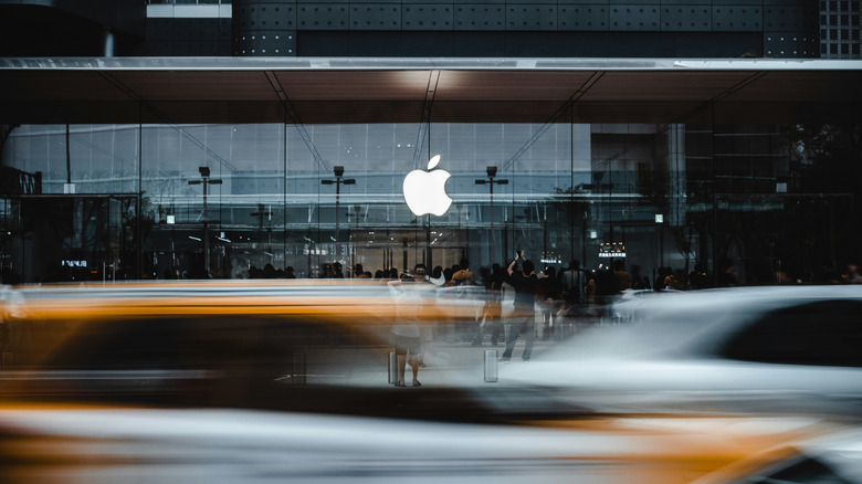 An Apple Store behind traffic.