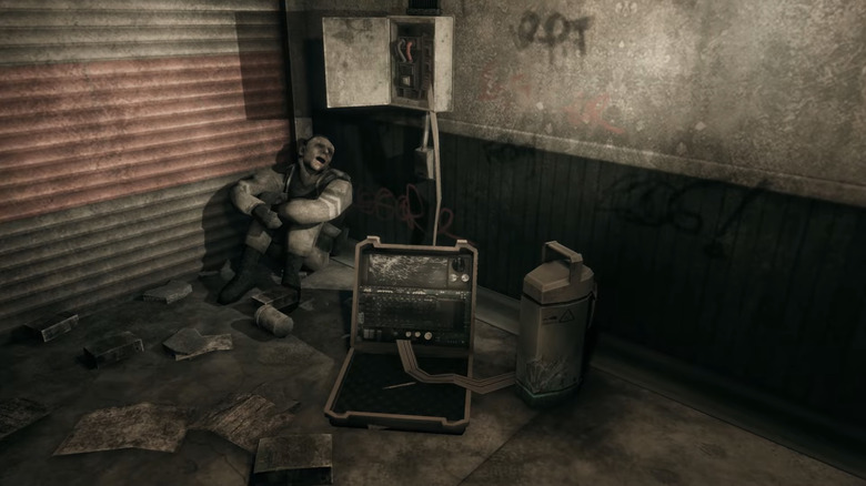A dead person next to an open container.