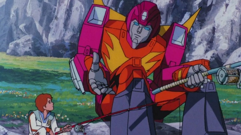 A screenshot from the Transformers movie featuring Hot Rod and Daniel.