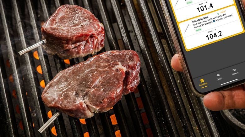 The RFX Meat Mini wireless grill probe in steaks.