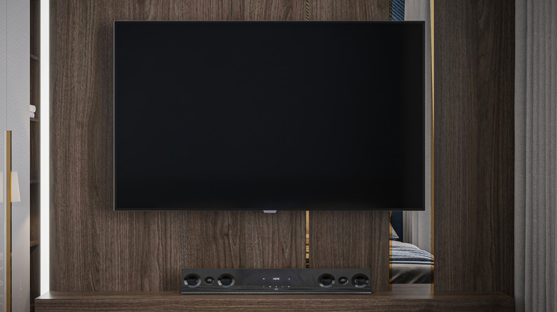 Бюджетные саундбары как доступный способ добавить Dolby Atmos к телевизору Современная гостиная с телевизором и саундбаром