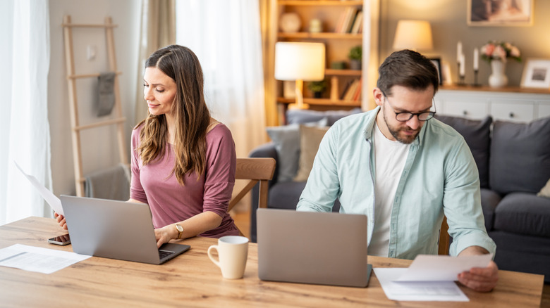 Two people on their computers