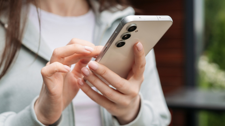 Person using a Samsung Galaxy phone.