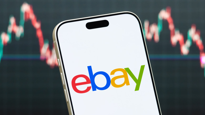 eBay opened on a phone over sales chart.
