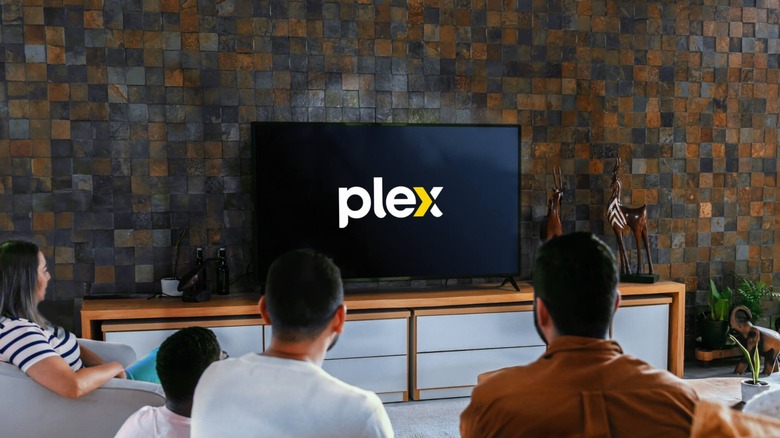 Family watching TV with Plex app in living room