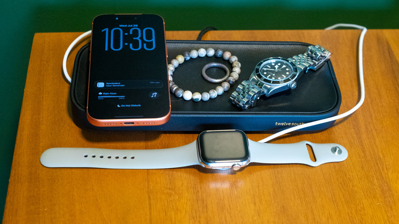 The Twelve South Valet on a desk with a phone, watch and other items.