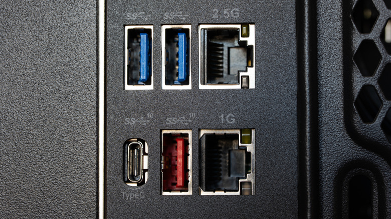 Various USB and Ethernet ports on the back of a computer.