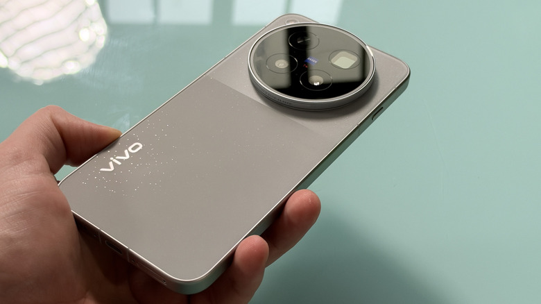 Vivo X500 Pro Max held in hand, displaying the rear of the device.