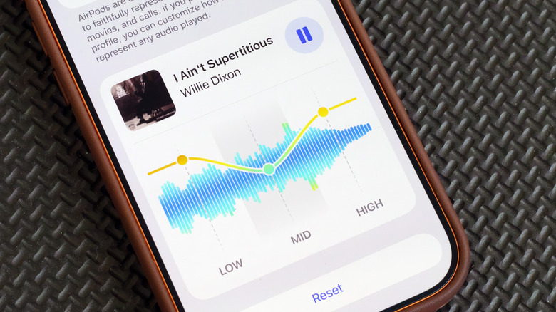 An iPhone screen with AirPods EQ settings (iOS 27).