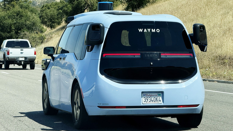 Waymo autonomous Zeekr electric robotaxi driving along California highway