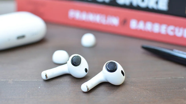 Two AirPods on a table.