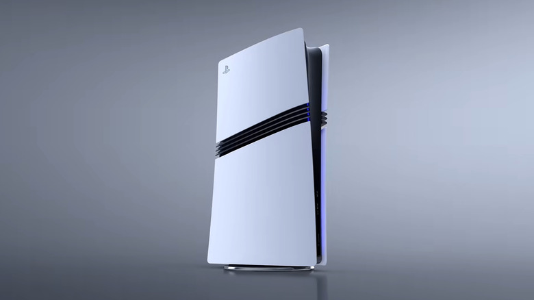 A white PS5 Pro lights up against a dark grey background