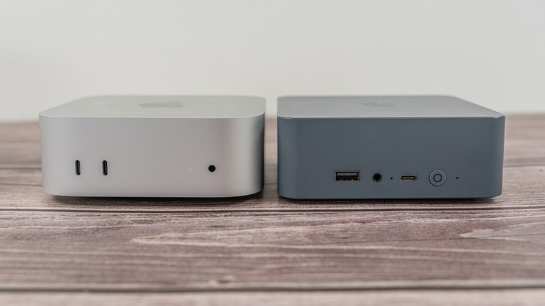 An Apple Mac Mini next to a mini PC on a desk.