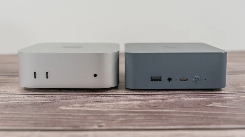 An Apple Mac Mini next to a mini PC on a desk.
