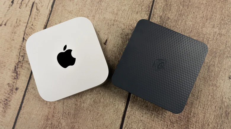 An Apple Mac Mini positioned next to a Beelink mini PC