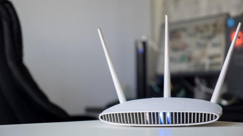 Close-up of a router sitting on a table.