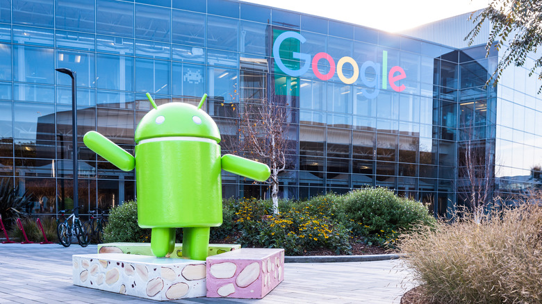 The Android mascot pictured outside of a Google office building.