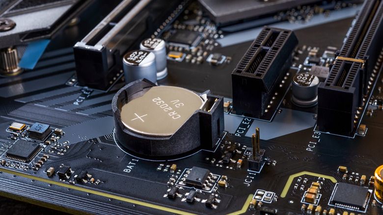 Close-up of a CMOS battery on a computer motherboard.